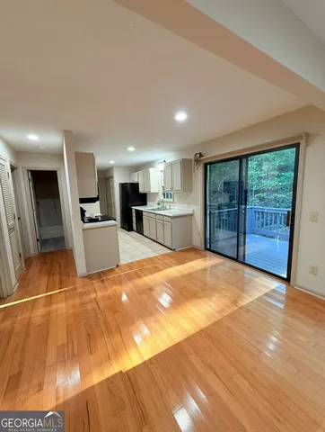 a view of a kitchen with furniture and a flat screen tv