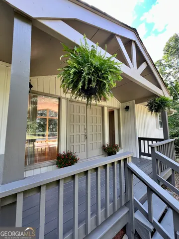 a view of balcony with furniture