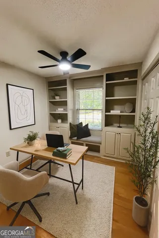 a workspace with furniture and a window