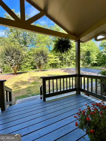 a view of a balcony with wooden floor