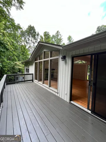 a view of outdoor space with deck and barbeque oven