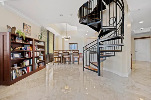 a kitchen with stainless steel appliances granite countertop a sink a stove a microwave and wooden cabinets