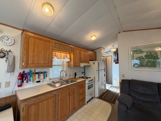2795 East 28th Road Marseilles, IL 61341 - Photo 11 of 69 a kitchen with stainless steel appliances a refrigerator a sink dishwasher stove and white countertops with wooden floor