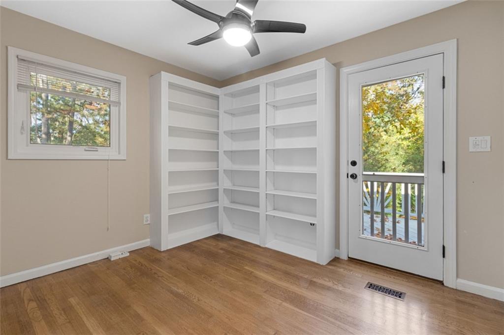 2958 Harcourt Drive, Unit 1 Decatur, GA 30033 - Photo 24 of 32 a view of an empty room with a window and wooden floor