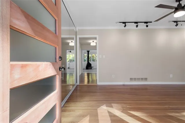 a view of a living room with furniture and a flat screen tv