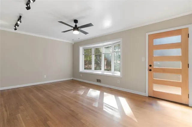 a view of an empty room with a window