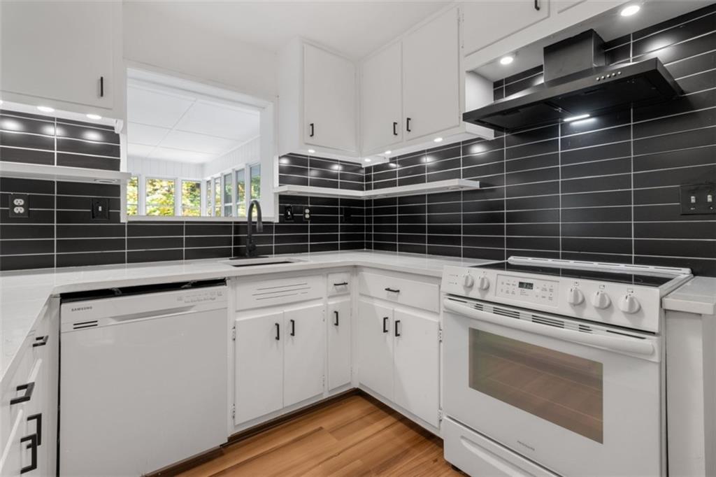 2958 Harcourt Drive, Unit 1 Decatur, GA 30033 - Photo 7 of 32 a kitchen with appliances cabinets and a stove top oven