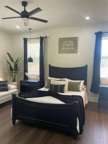 a bathroom with a sink vanity and mirror