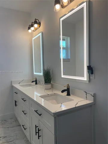 a bathroom with a bathtub and a sink