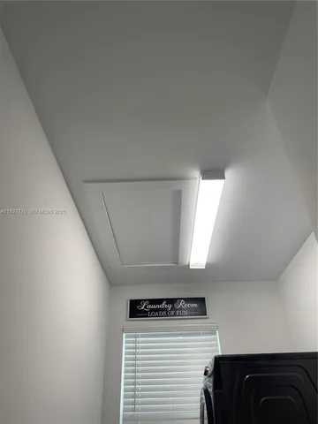 a bathroom with a sink mirror vanity and toilet