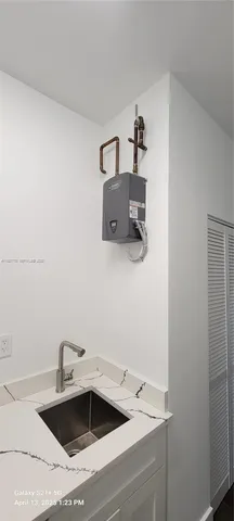 a bedroom with a bed window and a desk