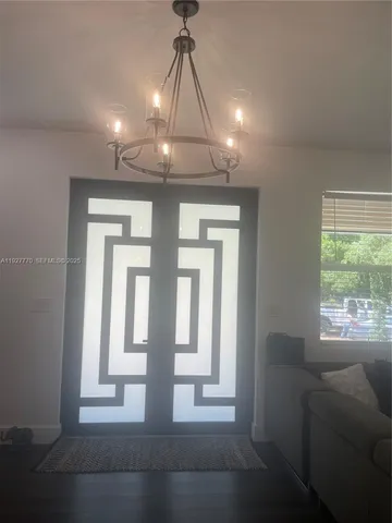 a view of entryway and hall with a window