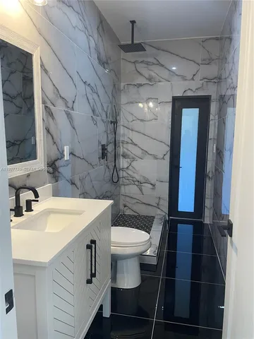 a view of house next to a yard