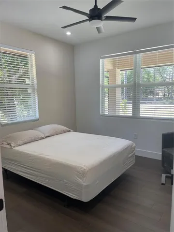 a view of a house with a tree beside it