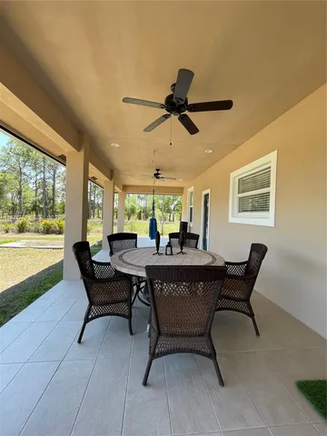 a sitting area with furniture and a lake view