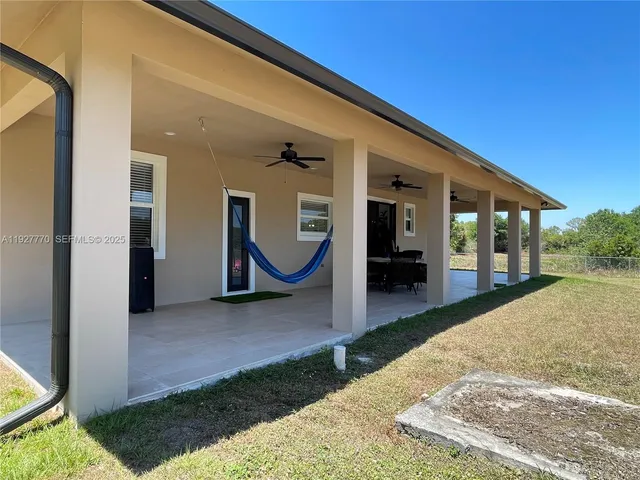 a view of a yard and an trees