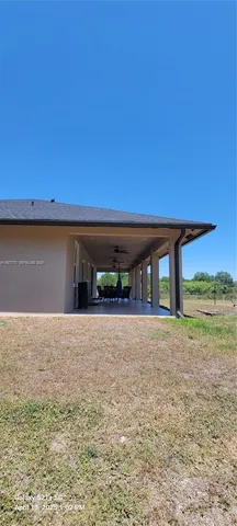 a view of a barn in the middle of a yard