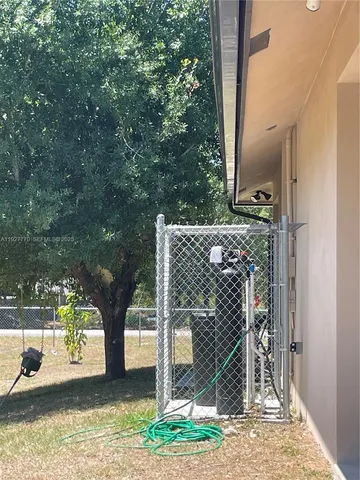 a view of a road with a tree in the background