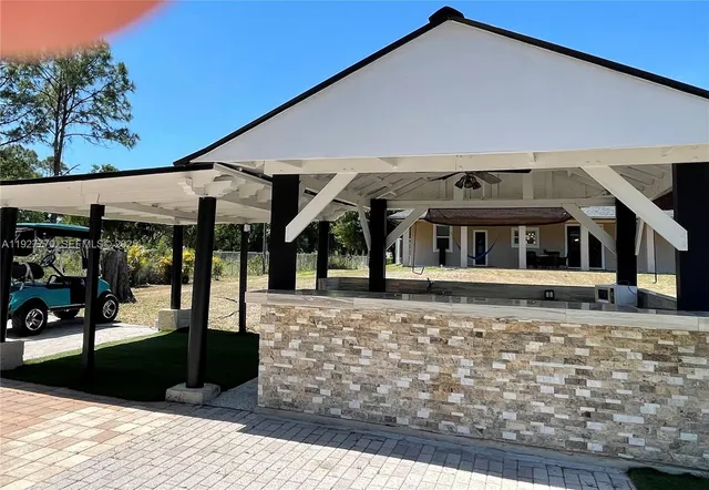 a view of a chairs and tables in the patio
