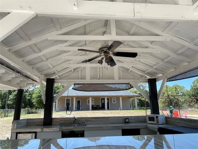 a view of a park with swings and slides
