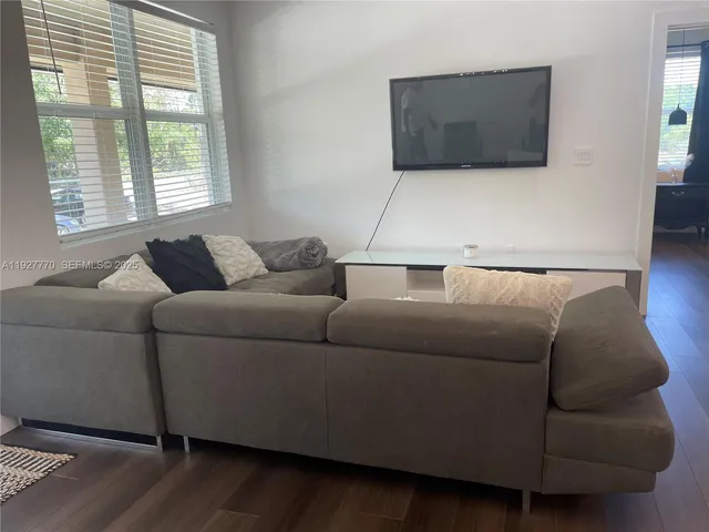 a living room with a couch and a flat screen tv