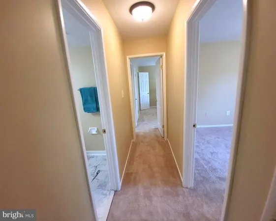 view of a hallway with wooden floor