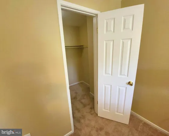 a view of a closet in a room