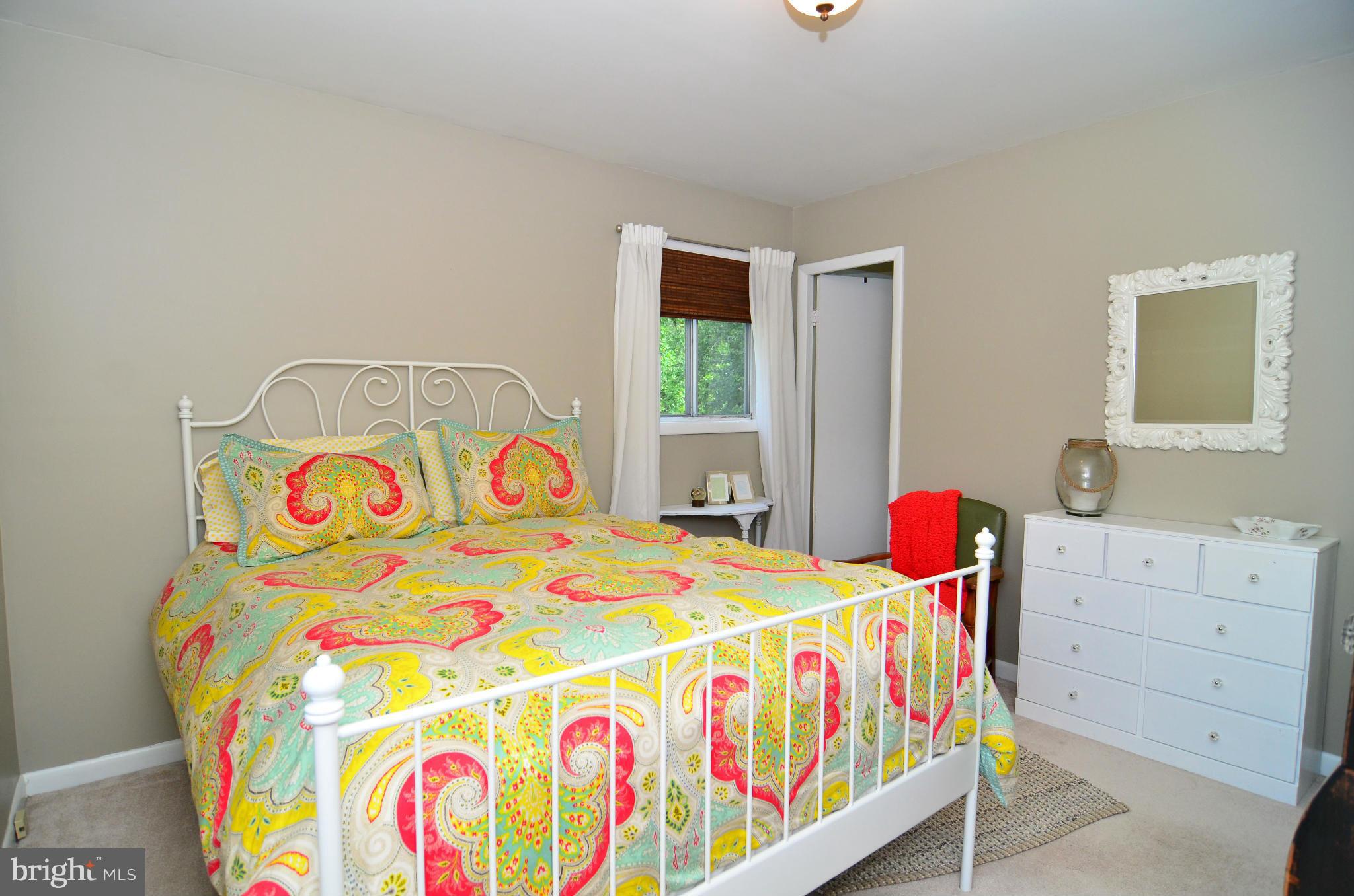 3049 Perch Drive Riva, MD 21140 - Photo 11 of 27 a bedroom with a bed that has a baby crib on it and a window
