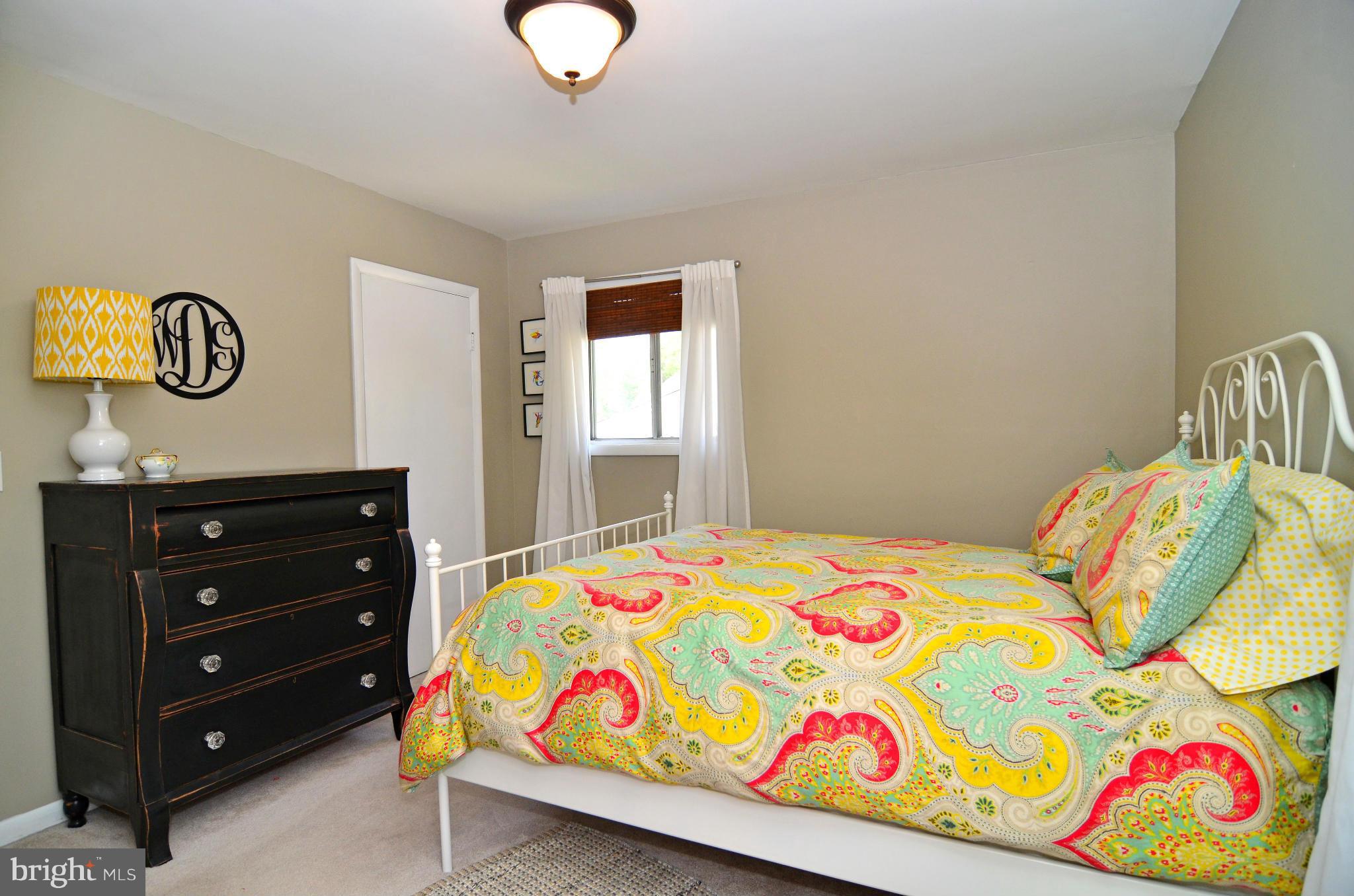 3049 Perch Drive Riva, MD 21140 - Photo 12 of 27 a bedroom with a bed and a dresser in it