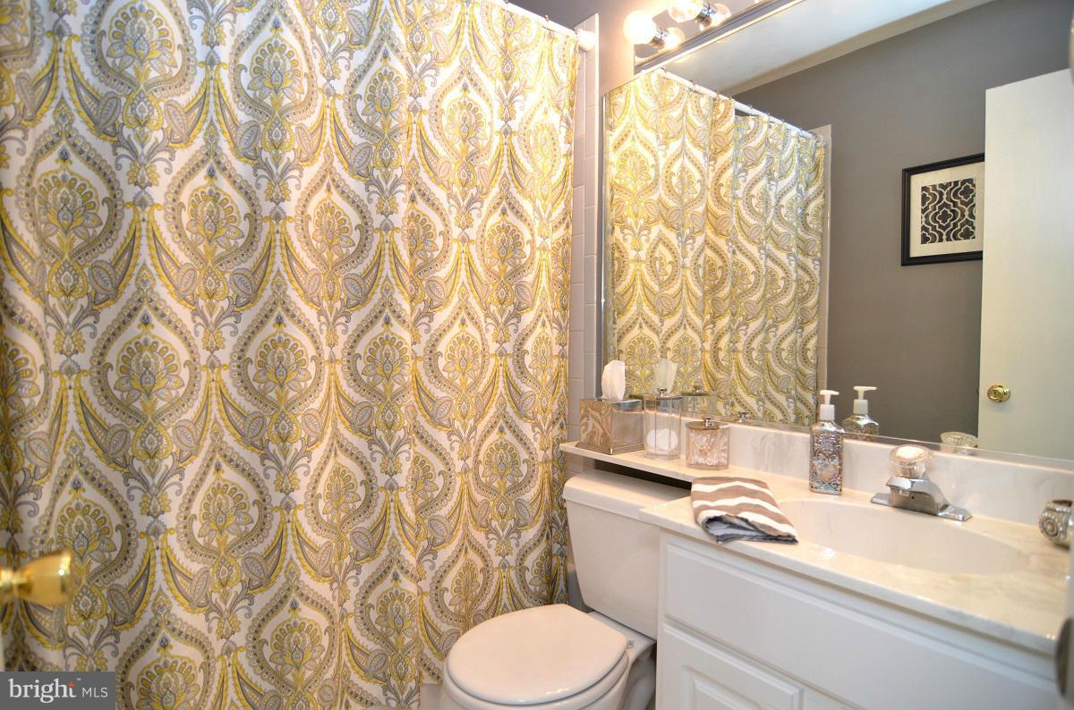 3049 Perch Drive Riva, MD 21140 - Photo 16 of 27 a bathroom with a sink toilet and shower