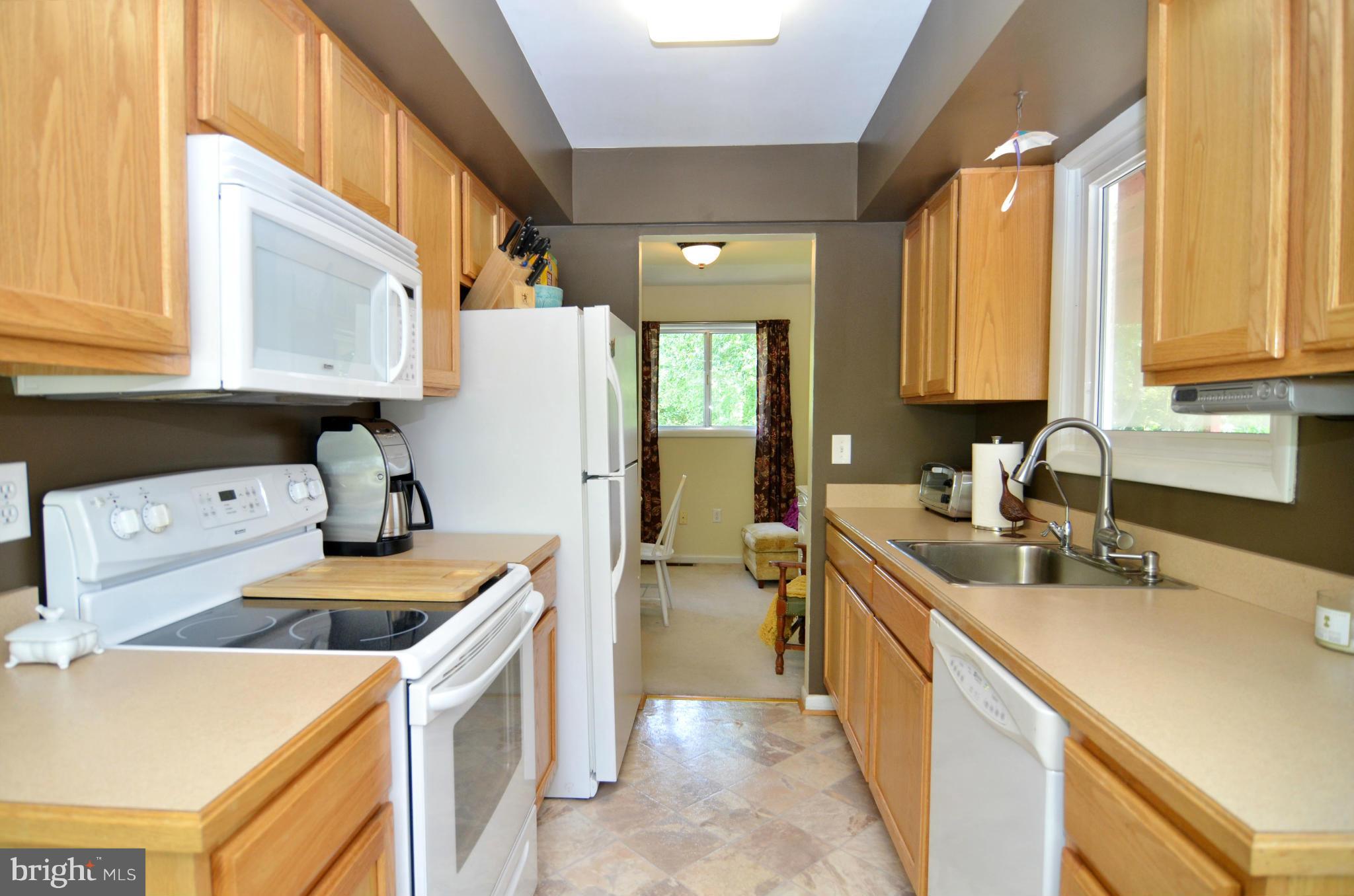 3049 Perch Drive Riva, MD 21140 - Photo 5 of 27 a kitchen that has a sink a stove and a refrigerator