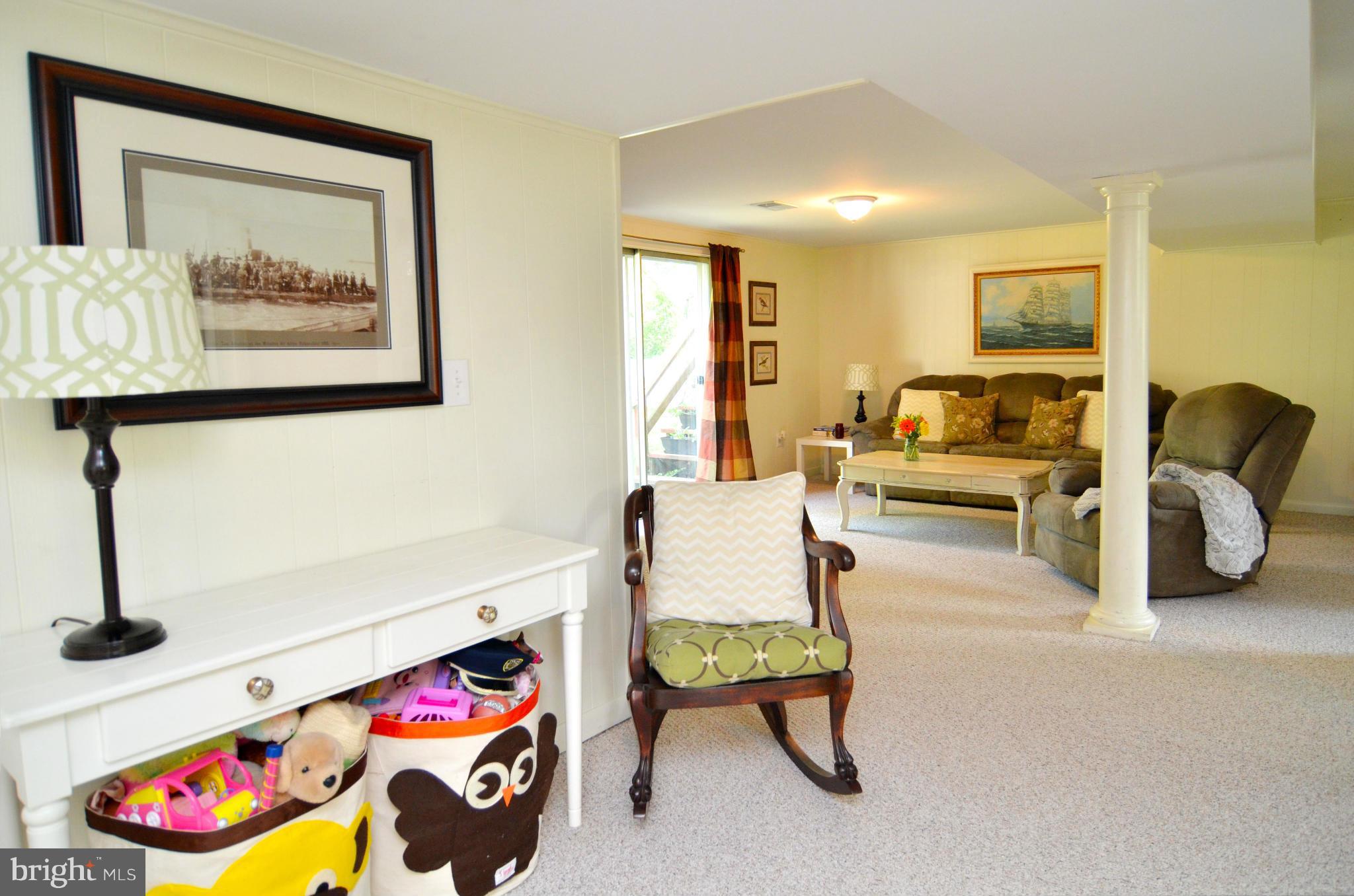3049 Perch Drive Riva, MD 21140 - Photo 9 of 27 a living room with furniture and a baby crib