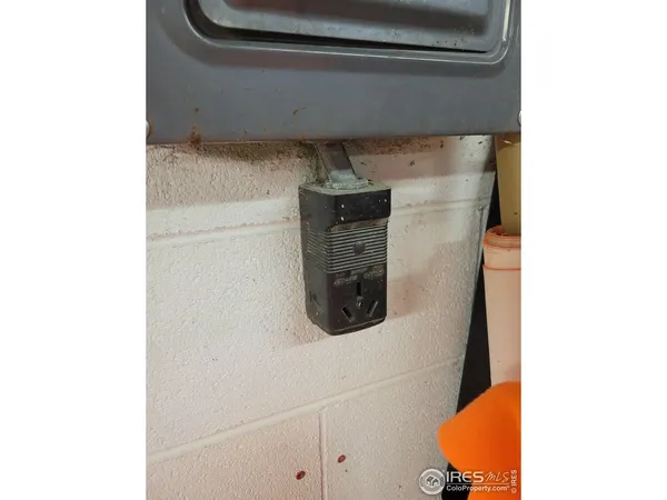 a close view of a utility room with dryer and washer