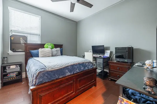 a bedroom with a bed and a tv