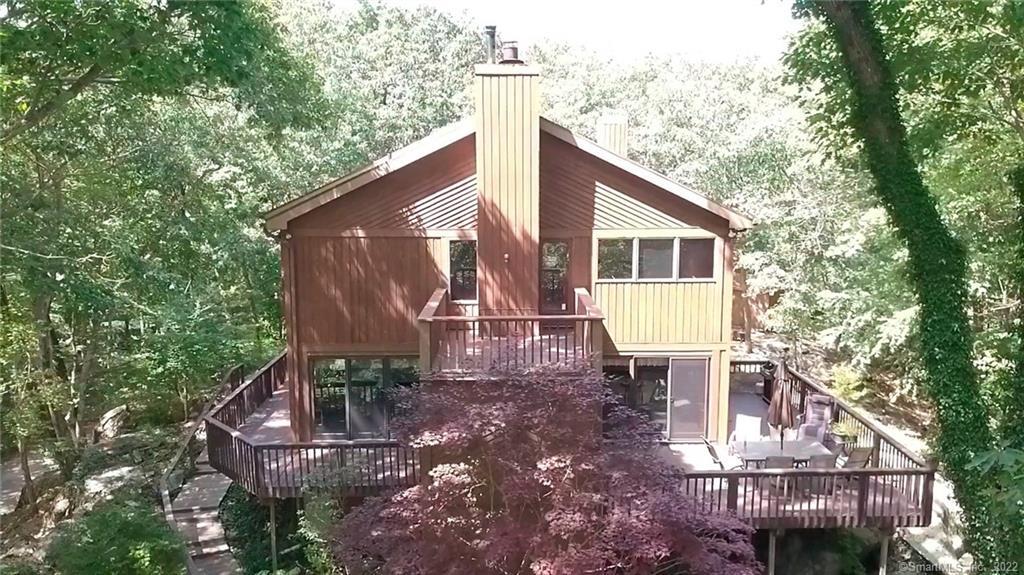 27 Rowledge Pond Road Newtown, CT 06482 - Photo 1 of 1 A four-season view of nature's changing colors and light!