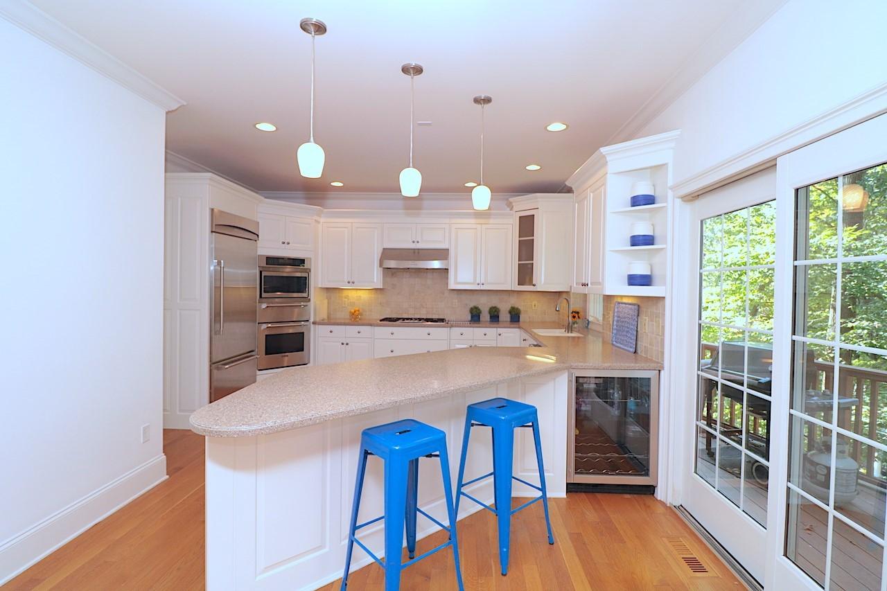 32 Briar Street Rowayton, CT 06853 - Photo 13 of 40 a kitchen with cabinets and wooden floor