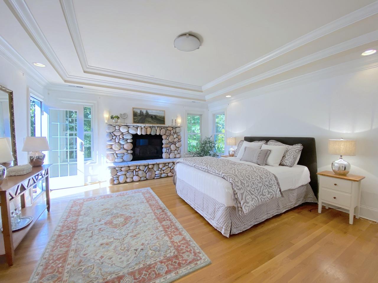 32 Briar Street Rowayton, CT 06853 - Photo 18 of 40 a spacious bedroom with a bed and a flat screen tv