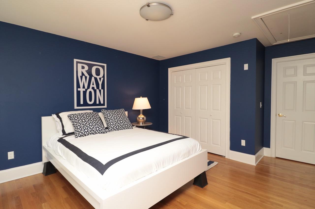 32 Briar Street Rowayton, CT 06853 - Photo 22 of 40 a bedroom with a bed and wooden floor