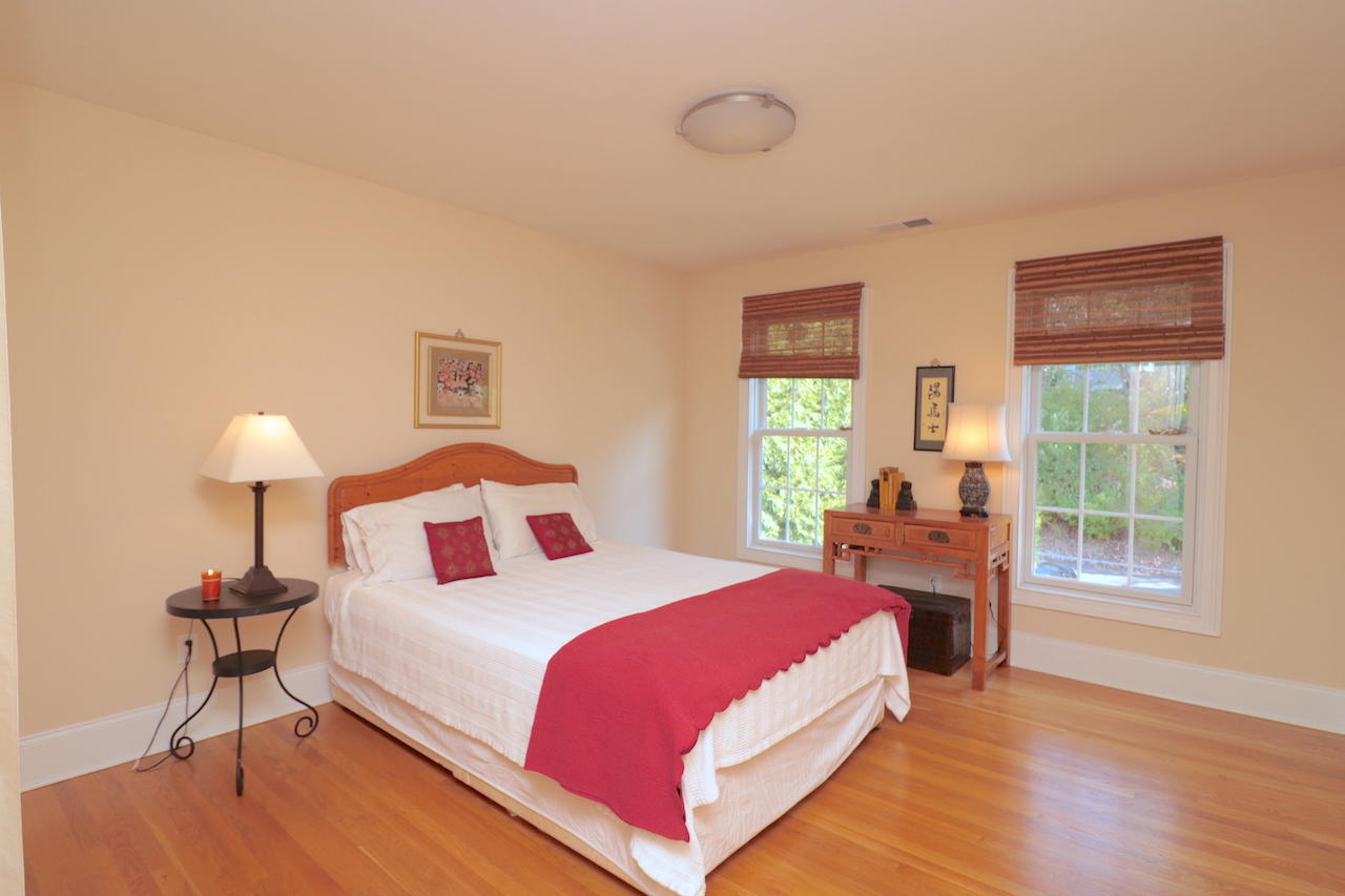 32 Briar Street Rowayton, CT 06853 - Photo 23 of 40 a bedroom with a bed lamp on table and a window