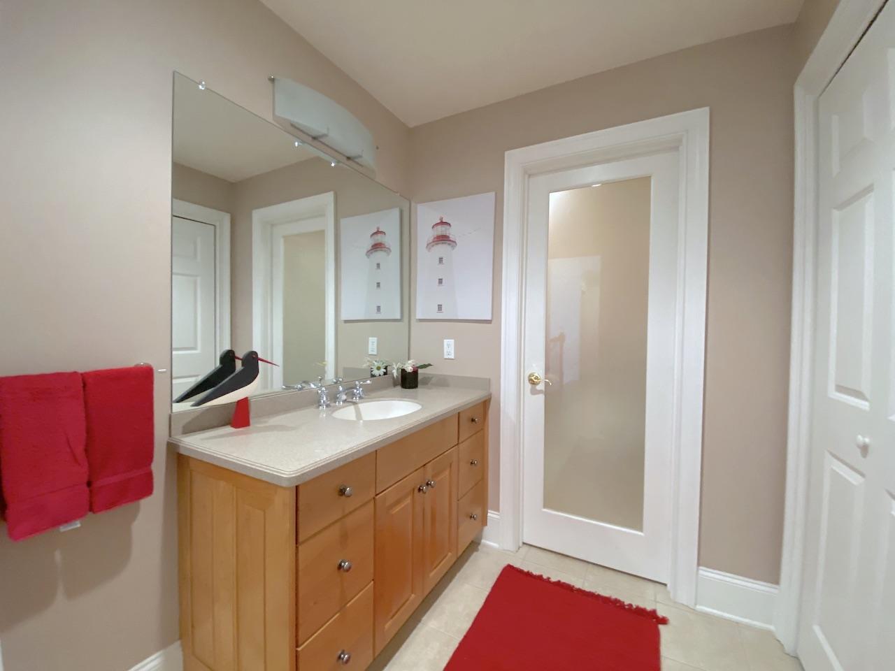32 Briar Street Rowayton, CT 06853 - Photo 25 of 40 a bathroom with a sink vanity and a mirror