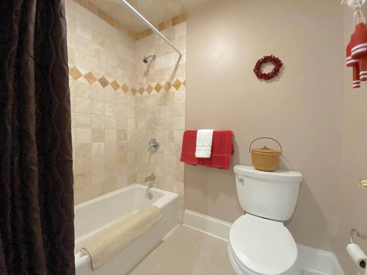 32 Briar Street Rowayton, CT 06853 - Photo 26 of 40 a bathroom with a bath tub a toilet sink and mirror