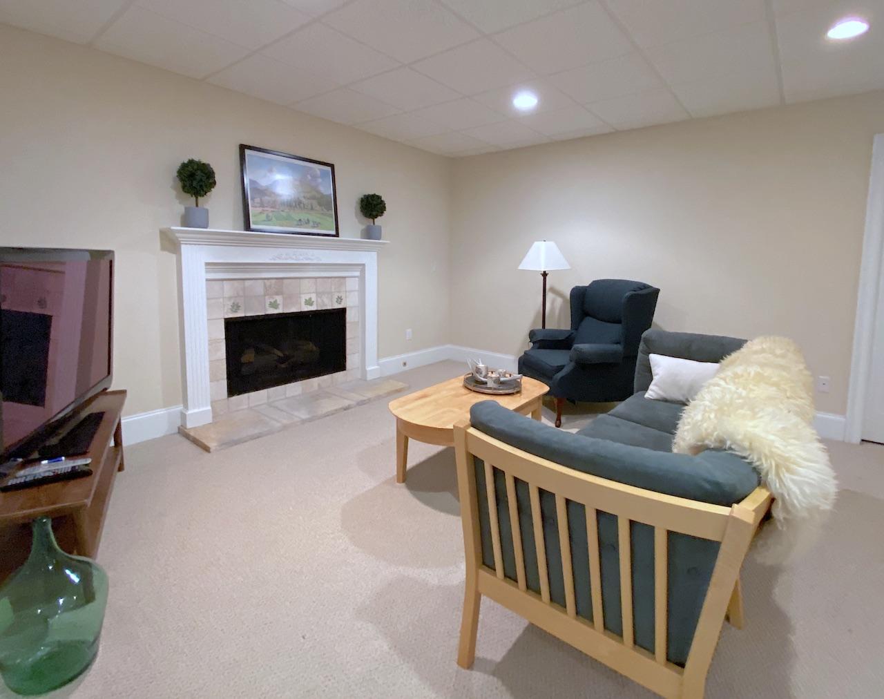 32 Briar Street Rowayton, CT 06853 - Photo 28 of 40 a bedroom with furniture and a fireplace