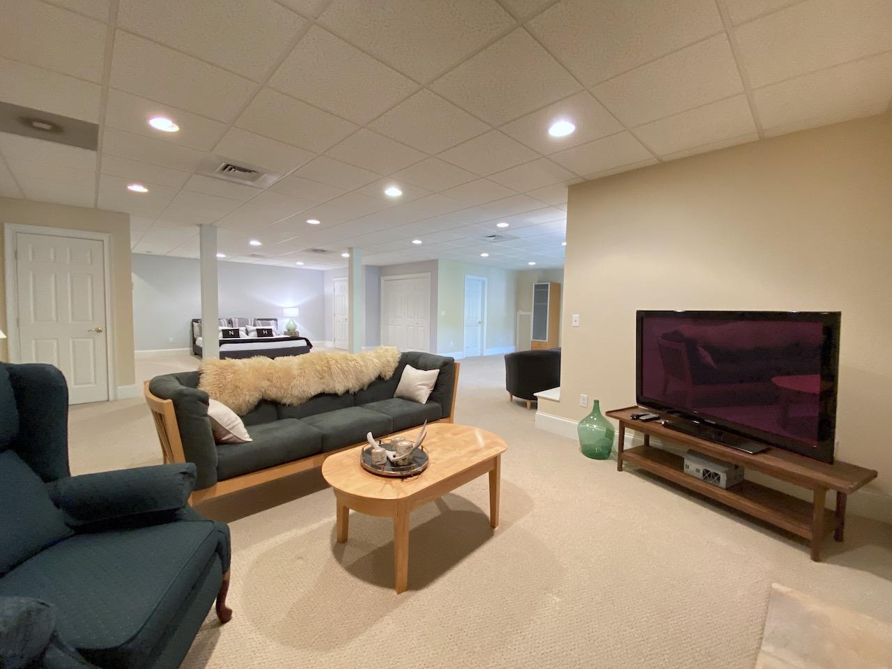 32 Briar Street Rowayton, CT 06853 - Photo 29 of 40 a living room with furniture a flat screen tv and a couch