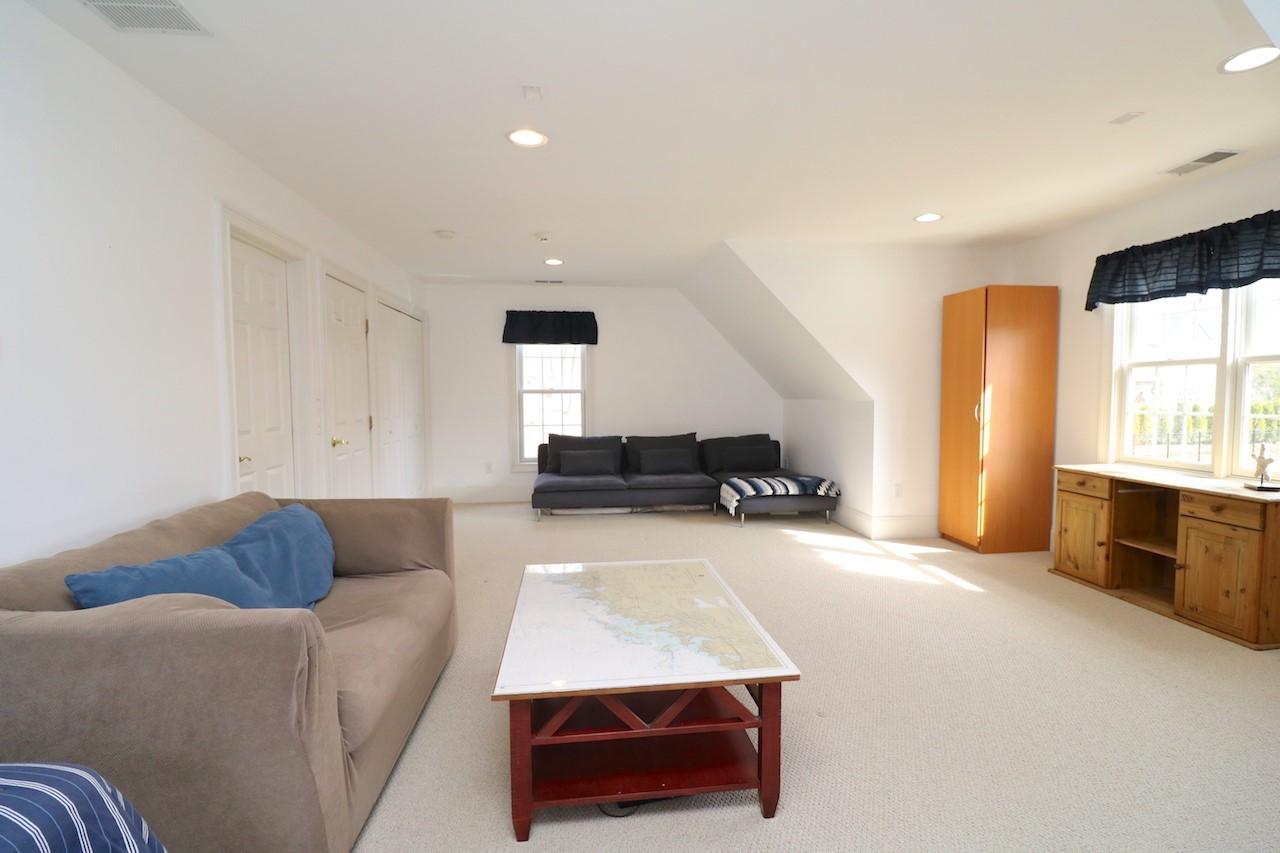 32 Briar Street Rowayton, CT 06853 - Photo 32 of 40 a living room with furniture and a window