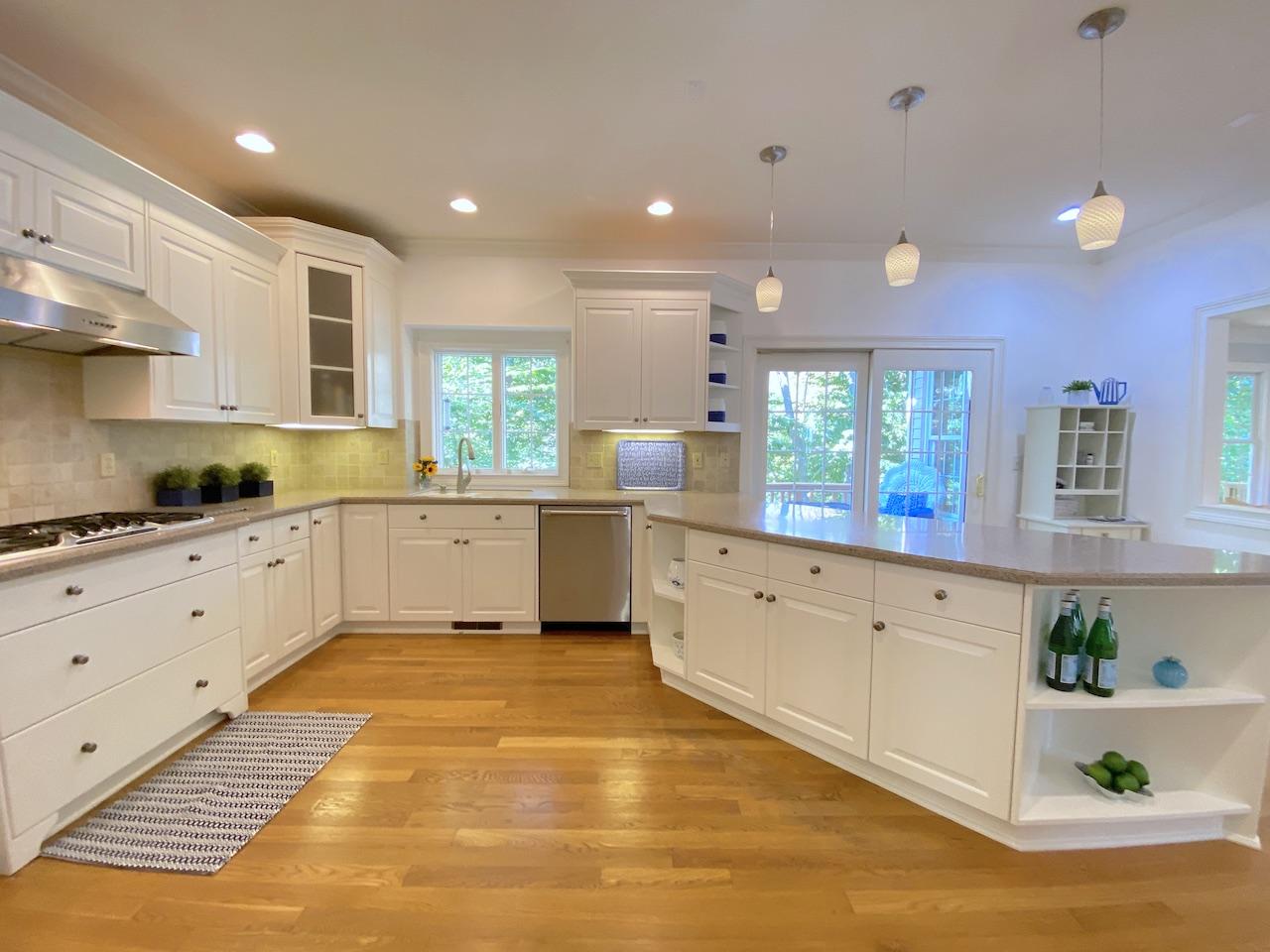 32 Briar Street Rowayton, CT 06853 - Photo 10 of 40 a large kitchen with stainless steel appliances cabinets a sink and a counter top space