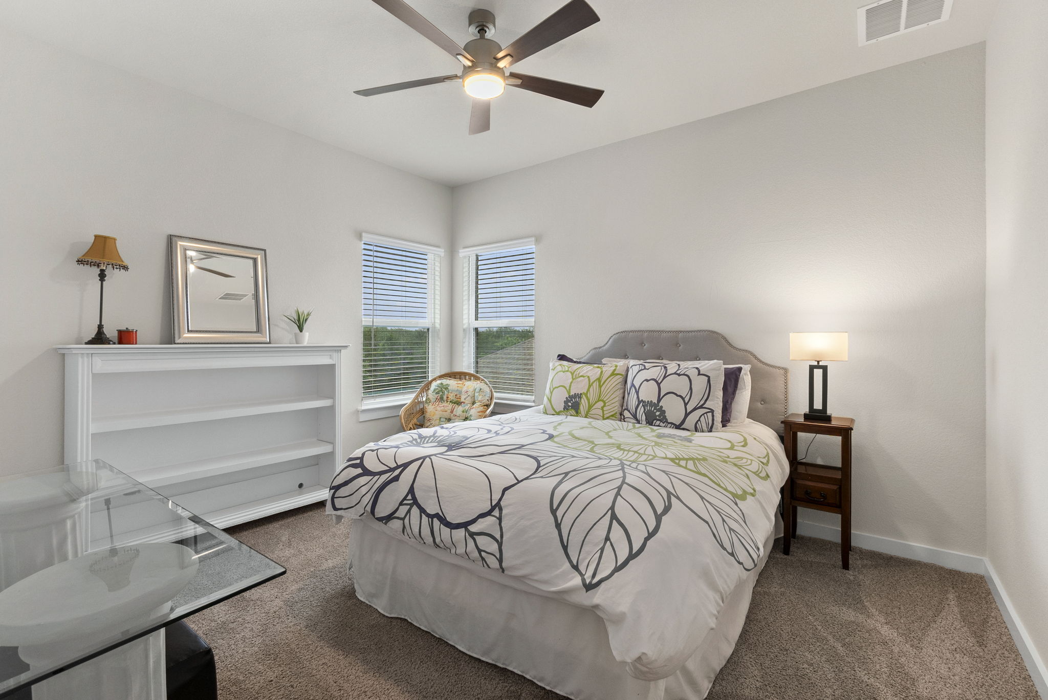 460 Constitution Way Kyle, TX 78640 - Photo 31 of 40 Bedroom featuring two windows with blinds, a ceiling fan with integrated lighting, and carpet flooring