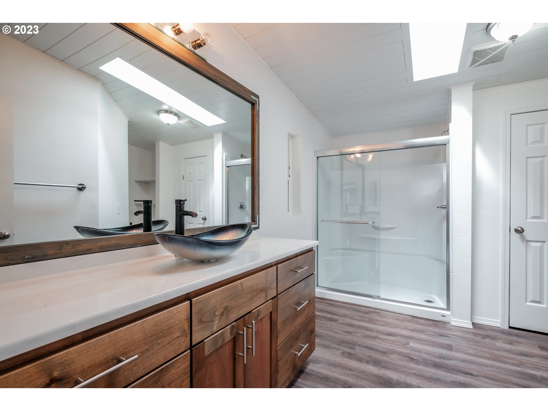 524 6th Street Scotts Mills, OR 97375 - Photo 16 of 41 a bathroom with a granite countertop sink mirror and shower