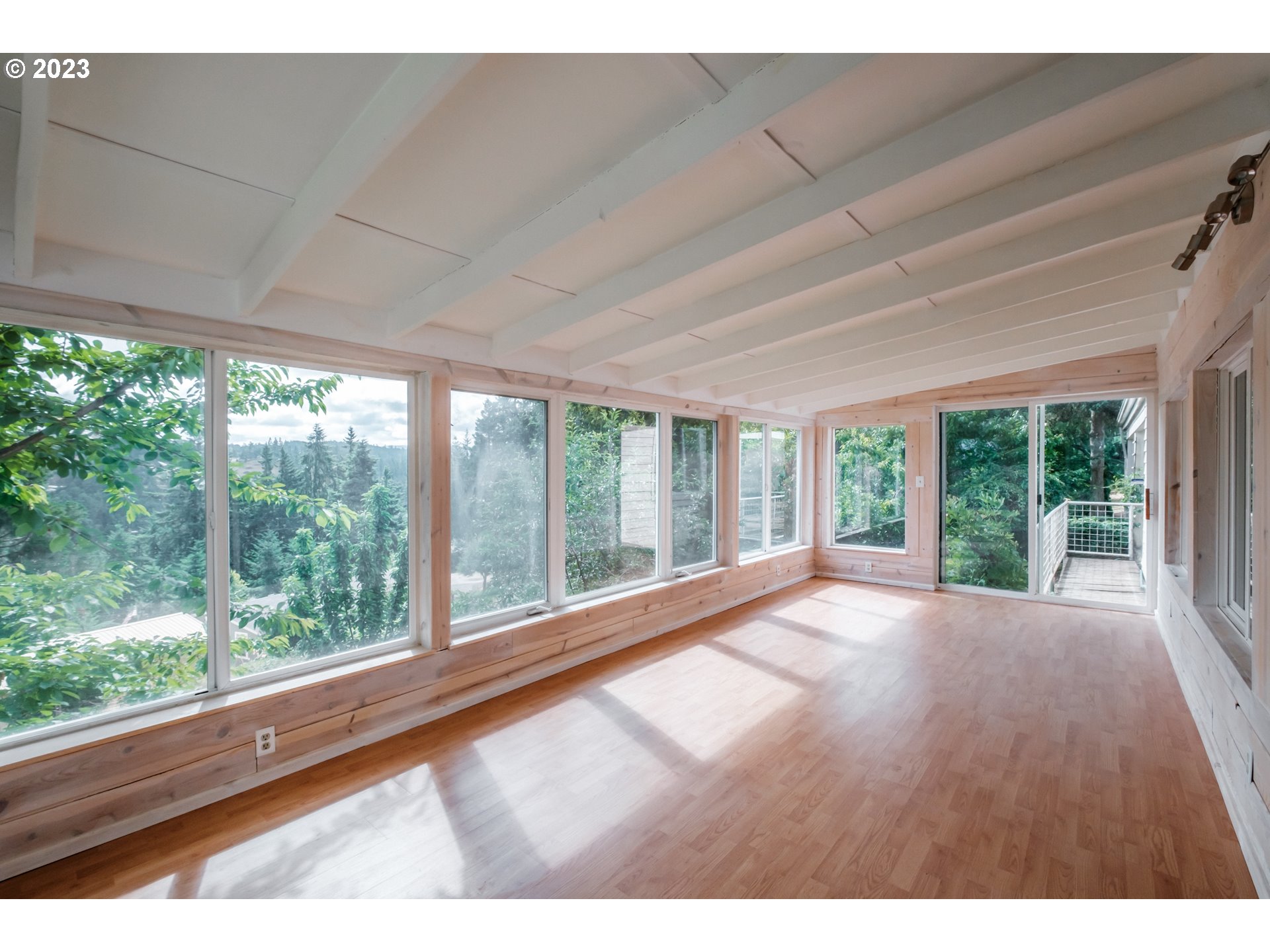 524 6th Street Scotts Mills, OR 97375 - Photo 19 of 41 a view of an empty room with wooden floor and doors