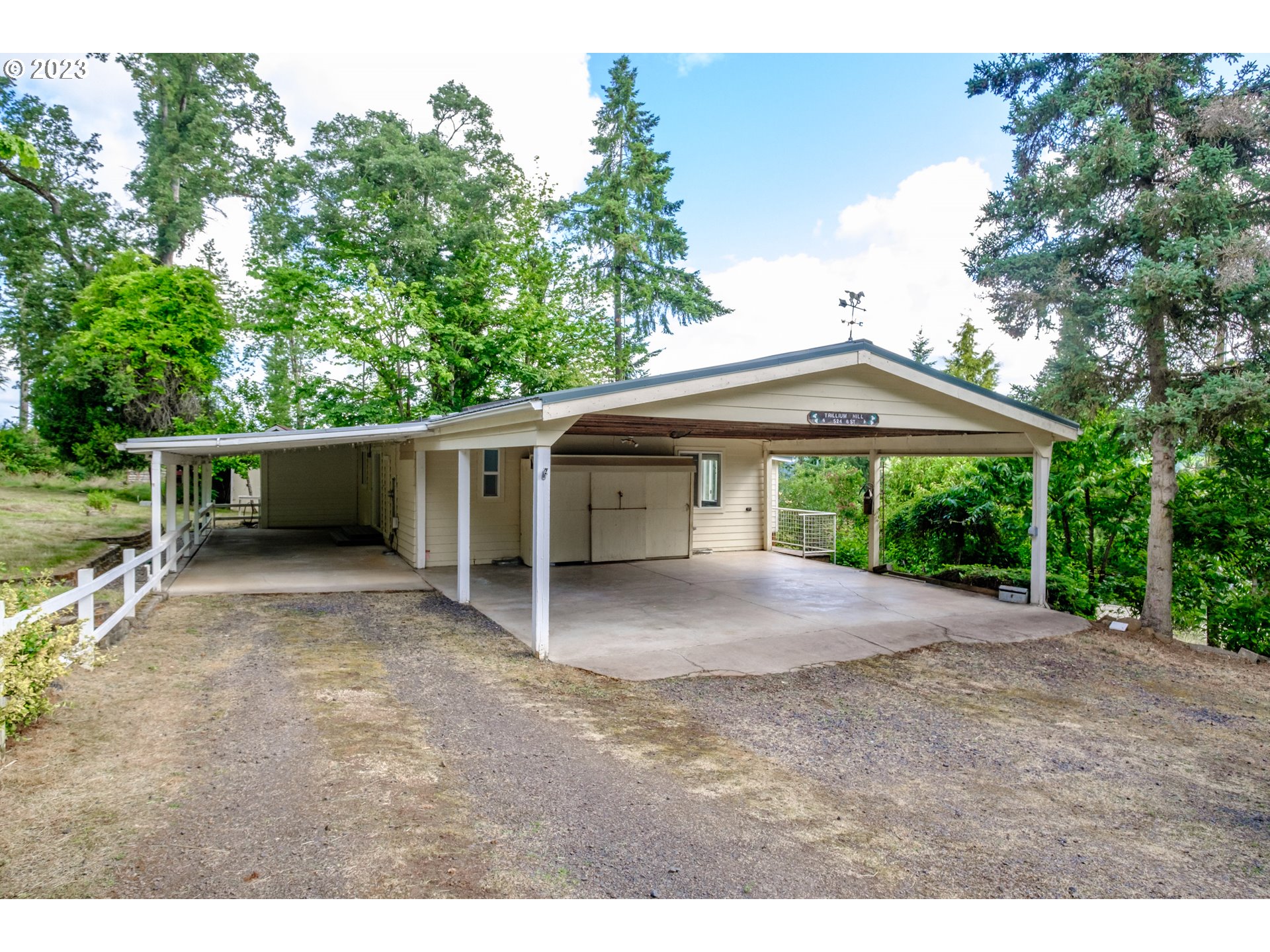 524 6th Street Scotts Mills, OR 97375 - Photo 2 of 41 a view of a house with a yard and a large tree
