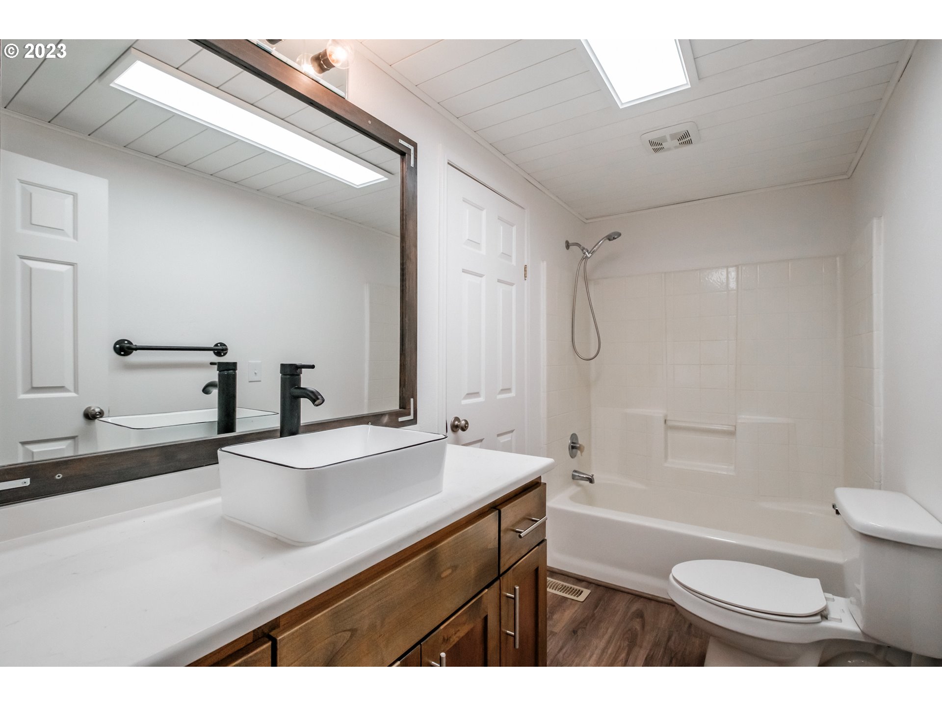 524 6th Street Scotts Mills, OR 97375 - Photo 23 of 41 a bathroom with a sink a toilet a mirror and shower